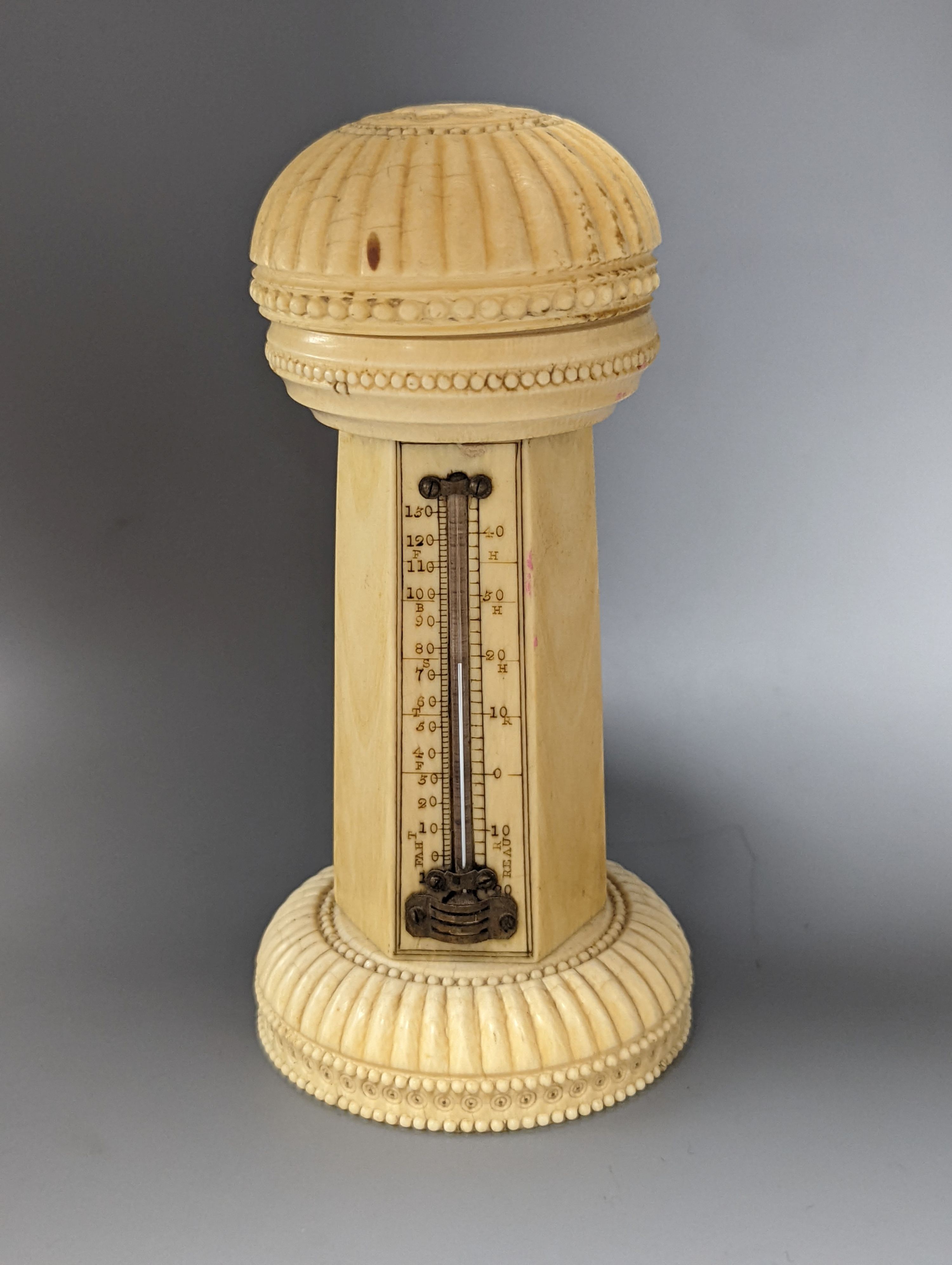 A 19th century ivory table thermometer, 13cm.